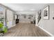 Basement features wood-look floors, a walk-out, and a neutral color scheme at 8922 S Tuscany Ln, Highlands Ranch, CO 80130