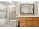 Bright bathroom features an updated vanity, a granite countertop, and a stand-up shower at 8922 S Tuscany Ln, Highlands Ranch, CO 80130