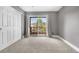 Bedroom with carpet, closet and a sliding glass door to the outside balcony at 8922 S Tuscany Ln, Highlands Ranch, CO 80130