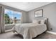 Bedroom with carpet and a large window for natural light with backyard view at 8922 S Tuscany Ln, Highlands Ranch, CO 80130