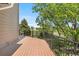 A lovely deck view overlooking the green outdoors, perfect for relaxation and entertaining at 8922 S Tuscany Ln, Highlands Ranch, CO 80130