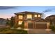 Charming two-story home featuring a brick and siding exterior, with an attached two-car garage at 8922 S Tuscany Ln, Highlands Ranch, CO 80130