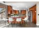 Spacious kitchen features an island with seating and modern stainless steel appliances at 8922 S Tuscany Ln, Highlands Ranch, CO 80130