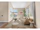 Cozy living room filled with natural light, comfortable seating, and modern decor at 8922 S Tuscany Ln, Highlands Ranch, CO 80130
