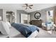 This lovely main bedroom features a comfortable seating area and ample natural light at 8922 S Tuscany Ln, Highlands Ranch, CO 80130