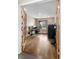 Office space with hardwood floors, natural light, a functional desk setup, and a tidy workstation environment at 8922 S Tuscany Ln, Highlands Ranch, CO 80130
