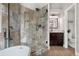 Modern shower with stylish tile and glass door, plus a view of the bathroom vanity at 8922 S Tuscany Ln, Highlands Ranch, CO 80130