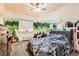 Inviting bedroom with mountain mural, neutral walls, a large bed, and ambient lighting at 333 Mesa St, Brighton, CO 80601