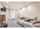 Cozy living room with plush sofa, carpeted floor, and access to bathroom and storage, perfect for relaxation at 333 Mesa St, Brighton, CO 80601