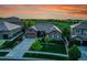 Beautiful aerial view of a home with a well-manicured lawn and lush landscaping next to a golf course at 27615 E Moraine Dr, Aurora, CO 80016