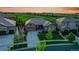 Beautiful aerial view of a home with well-manicured lawn and lush landscaping next to a golf course at 27615 E Moraine Dr, Aurora, CO 80016