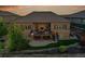 Beautiful backyard with a deck, patio, stone accents and a black metal fence at 27615 E Moraine Dr, Aurora, CO 80016
