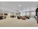 Spacious finished basement area with a pool table, card table and comfortable seating, perfect for entertaining at 27615 E Moraine Dr, Aurora, CO 80016