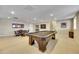 Large finished basement with a billiard table and game table providing lots of entertainment space at 27615 E Moraine Dr, Aurora, CO 80016