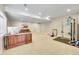 A versatile basement space features a wooden desk and workout area with exercise equipment at 27615 E Moraine Dr, Aurora, CO 80016