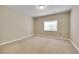 Bright and airy bedroom with neutral carpet, base trim and ample natural light at 27615 E Moraine Dr, Aurora, CO 80016