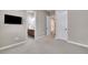 Bright bedroom with neutral carpet and doors leading to other areas of the house at 27615 E Moraine Dr, Aurora, CO 80016