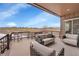 Relax on the covered patio with comfortable seating and views of the open landscape at 27615 E Moraine Dr, Aurora, CO 80016