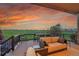 Spacious outdoor deck overlooking a golf course, with seating and great sunset views at 27615 E Moraine Dr, Aurora, CO 80016