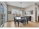 Bright dining area with sliding glass door and modern light fixture at 27615 E Moraine Dr, Aurora, CO 80016
