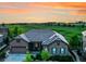 Beautiful single-Gathering home with stone accents and a well-manicured lawn backing to a golf course at 27615 E Moraine Dr, Aurora, CO 80016