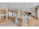 Gourmet kitchen with large island, granite countertops, stainless steel appliances and wooden cabinetry at 27615 E Moraine Dr, Aurora, CO 80016