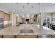 Elegant kitchen island features granite countertops and stylish pendant lighting at 27615 E Moraine Dr, Aurora, CO 80016