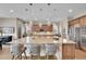 Beautiful kitchen island with granite countertops, pendant lighting, and barstool seating at 27615 E Moraine Dr, Aurora, CO 80016