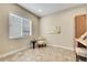 Cozy office with large window, decorative chair, and built-in desk at 27615 E Moraine Dr, Aurora, CO 80016