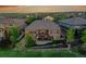 Stunning backyard featuring a spacious deck with fireplace and covered patio perfect for outdoor entertaining at 27615 E Moraine Dr, Aurora, CO 80016