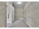 Spacious walk-in closet featuring white wire shelving and neutral carpet at 27615 E Moraine Dr, Aurora, CO 80016