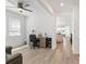 Bright living room featuring wood floors and a large window, creating a warm and inviting atmosphere at 23936 E River Front Dr, Aurora, CO 80019