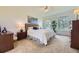 Bright bedroom featuring a plush bed, neutral decor and large windows offering an abundance of natural light at 15649 E 7Th Cir, Aurora, CO 80011
