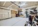 Spacious garage with ample storage shelves, pegboard, and a clean, painted floor at 15649 E 7Th Cir, Aurora, CO 80011