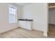 Unfinished basement featuring a wet bar and wood flooring at 585 Twilight St, Erie, CO 80516