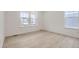 Sunlit bedroom featuring white wood floors and neutral walls at 585 Twilight St, Erie, CO 80516