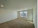 Spacious bedroom with carpeted floors and large windows at 585 Twilight St, Erie, CO 80516