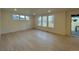 Spacious living room with hardwood floors and large windows offering natural light at 585 Twilight St, Erie, CO 80516