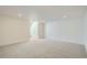 Bright, carpeted basement with recessed lighting and access to the stairs at 1785 Grayside Cir, Castle Rock, CO 80109