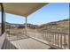 Wooden deck with white railings offering beautiful views of the surrounding landscape at 1785 Grayside Cir, Castle Rock, CO 80109