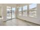 Dining area with sliding glass doors, chandelier, hardwood floors, and beautiful outdoor views at 1785 Grayside Cir, Castle Rock, CO 80109