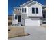 Charming two-story home with white siding, stone accents, and a spacious two-car garage in a desirable location at 1785 Grayside Cir, Castle Rock, CO 80109