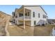 Exterior elevation showcasing the home's design, balcony, and surrounding landscape at 1785 Grayside Cir, Castle Rock, CO 80109