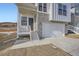 Detailed view of the home's entrance, showing the steps, porch, and two-car garage at 1785 Grayside Cir, Castle Rock, CO 80109