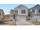 Charming modern farmhouse featuring stone accents, bright white siding, and a two-car garage at 1785 Grayside Cir, Castle Rock, CO 80109