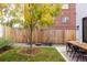Backyard featuring a dining set, Adirondack chairs, and wood fence, great for entertaining at 3422 S Grant St, Englewood, CO 80113