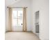 Bright bedroom with beige carpet boasts a neutral color palette and an attached bathroom at 3422 S Grant St, Englewood, CO 80113