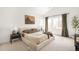Comfortable main bedroom with side tables, lamps, decor, and large window at 3422 S Grant St, Englewood, CO 80113