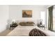 Bright main bedroom featuring two side tables and lamps with art and decor elements at 3422 S Grant St, Englewood, CO 80113