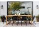 Outdoor dining area with modern chairs, wooden table, string lights, and decorative plants at 3422 S Grant St, Englewood, CO 80113